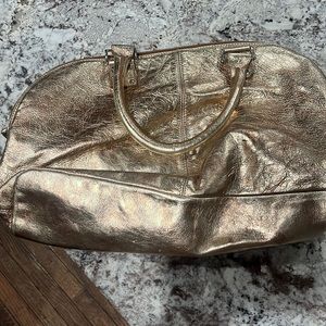 Guia’s made in Italy gold shoulder bag.